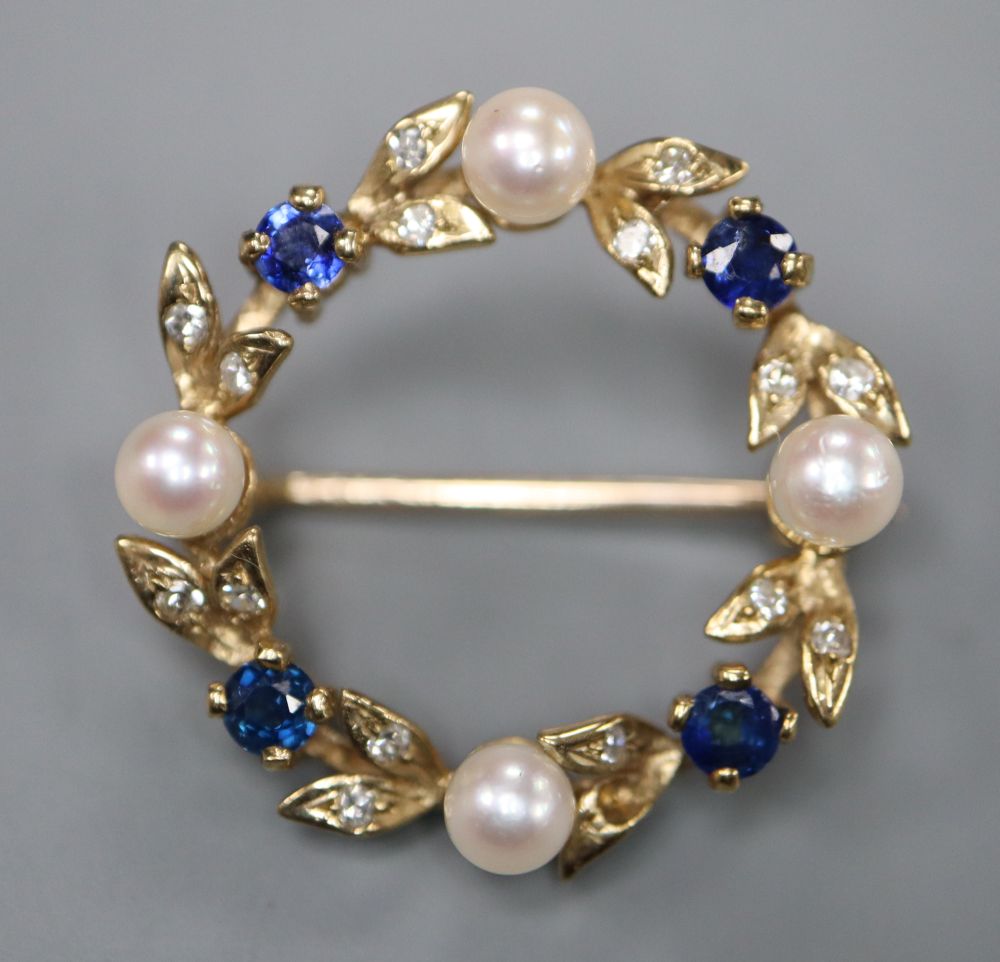 A modern 9ct gold, cultured pearl, sapphire and diamond set openwork brooch, 24mm, gross 4.1 grams.